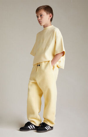 Kids Fear of God Essentials Garden Yellow Polar Fleece Sweatpants | PacSun